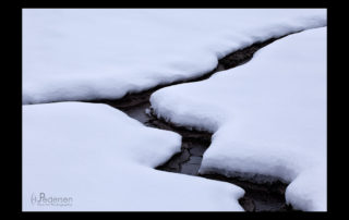 snow zigzag small stream winter grand tetons