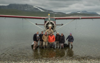 float plane and photographers in alaska
