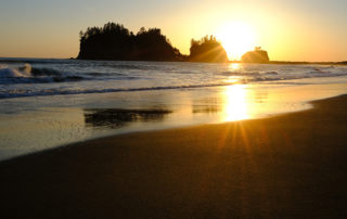 Setting sun over the ocean La Push Washington beach