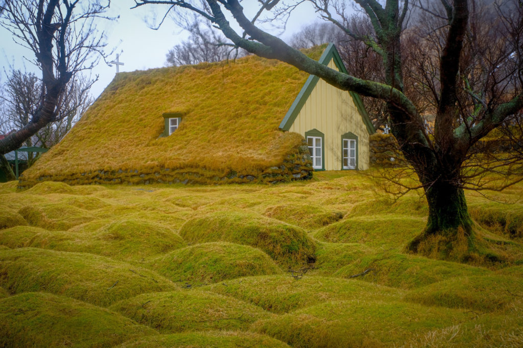 Grass roofed church with graves in Iceland