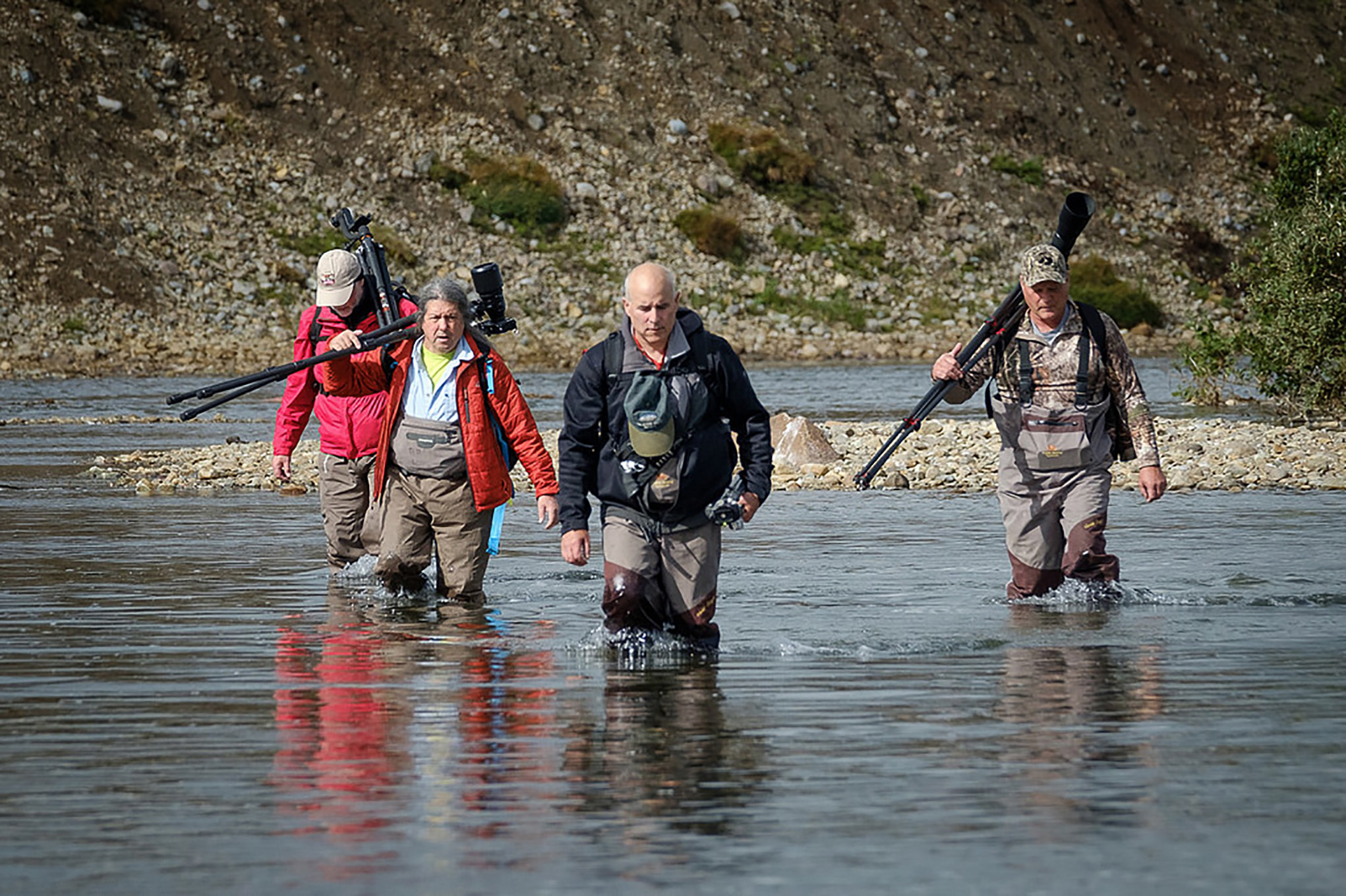 Leading a workshop in alaska crossing a river