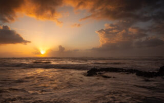 sunset along the oregon coast with clouds