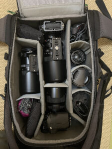 Photo backpack filled with camera gear