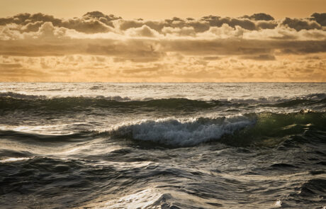 Waves in the ocean and cool clouds in the sky