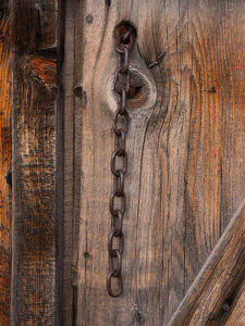 Weathered wood with chain hanging