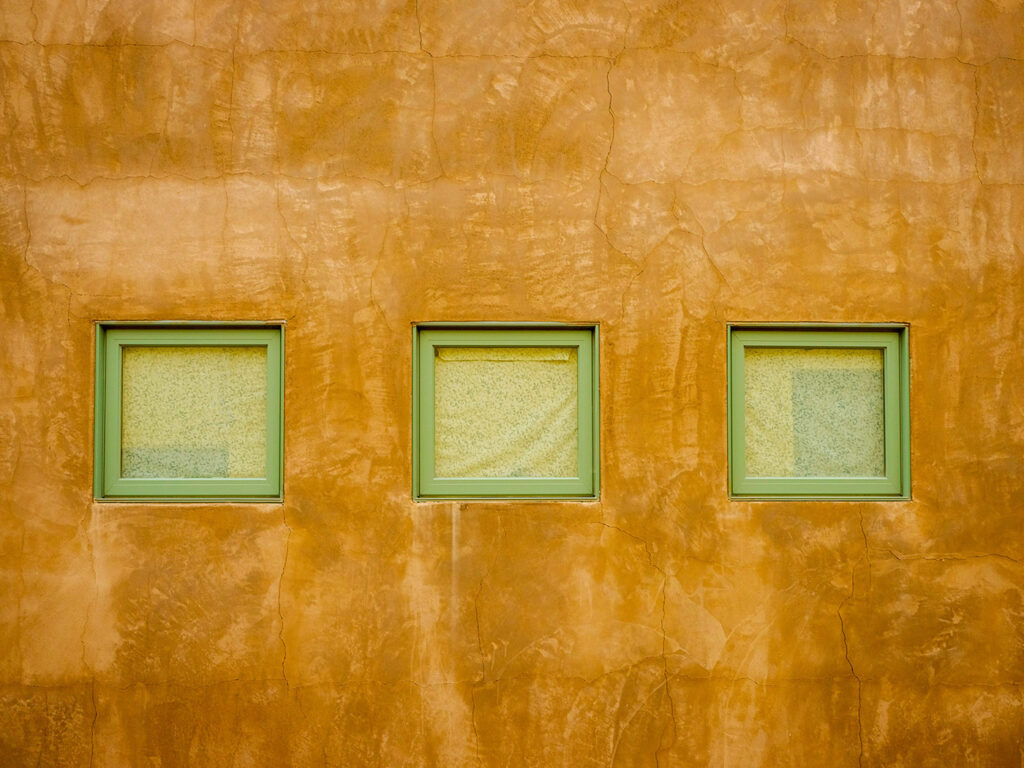 3 square windows set in a concrete wall in Arizona