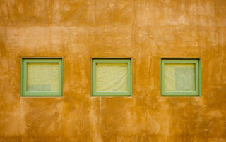 3 square windows set in a concrete wall in Arizona