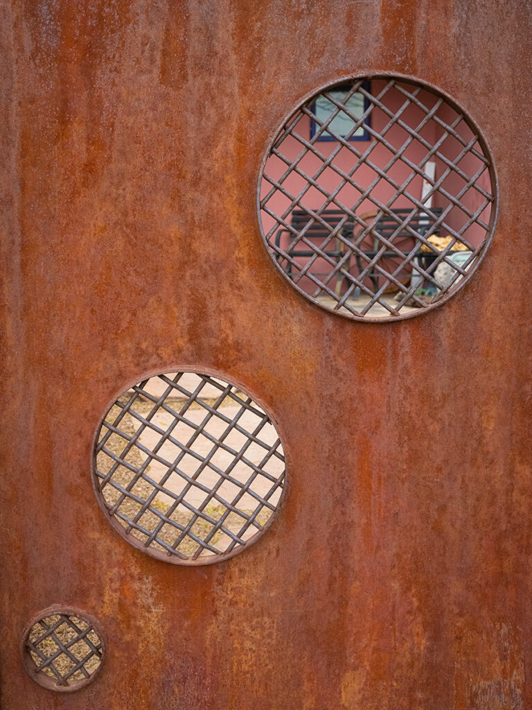 3 circles cut in to a gate in arizona