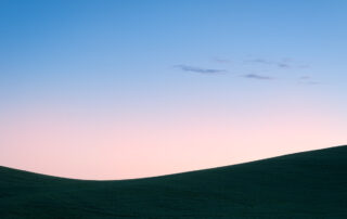 Photograph of sunrise over wheat fields in Palouse Washington