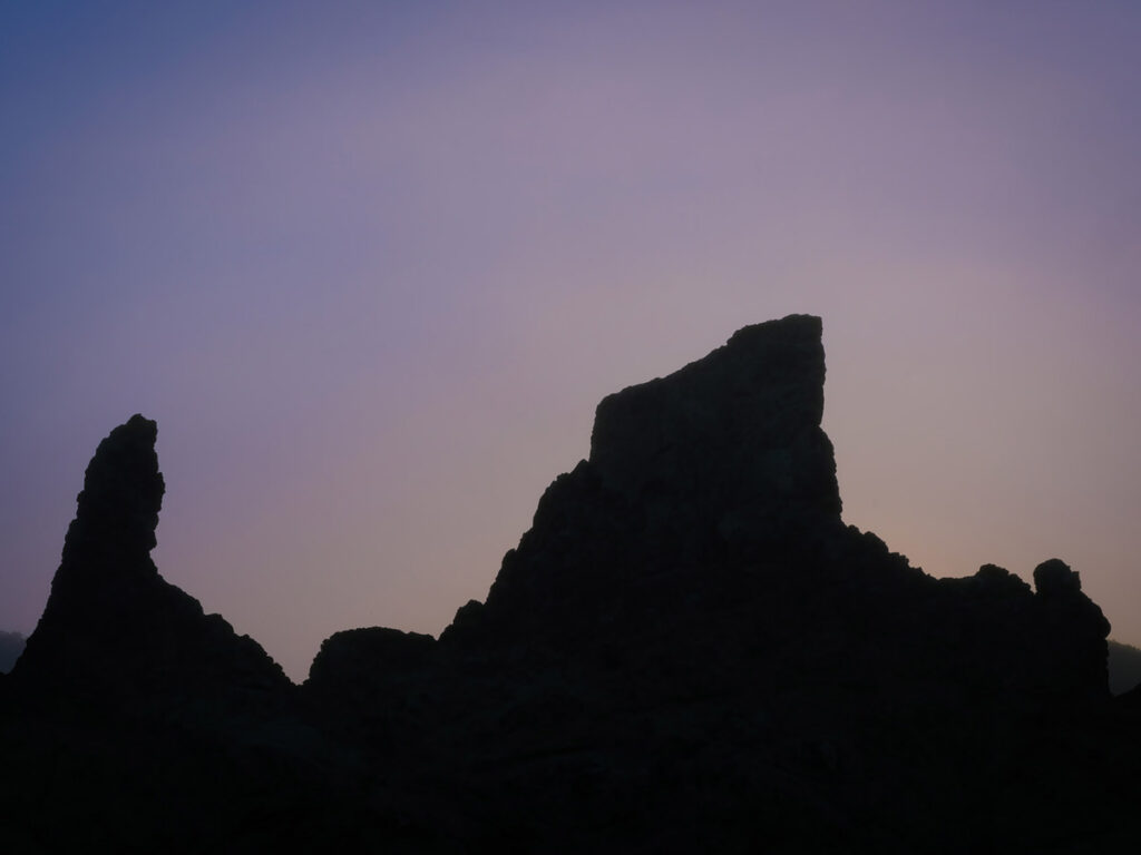 Sunrise light behind sea stacks along the Oregon coast