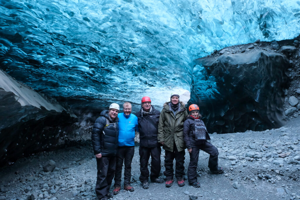 Workshop group posing in an ice cave in Iceland