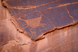 Petroglyphs etched on the wall in Monument Valley