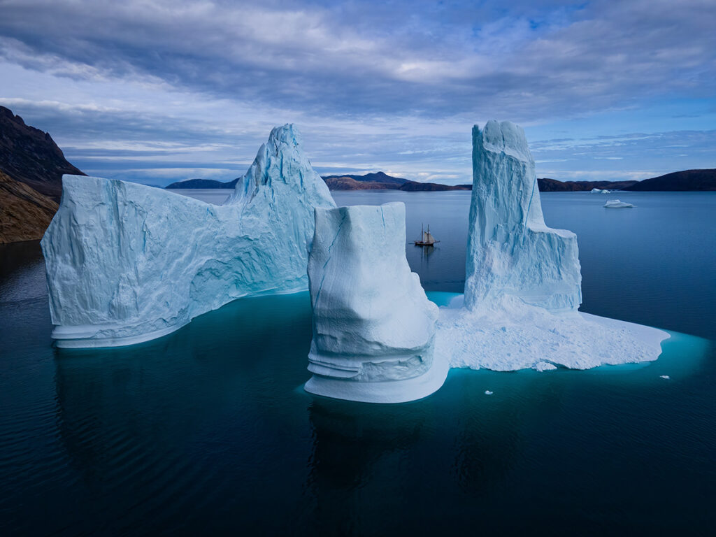 Sailboat and iceberg in Greenland